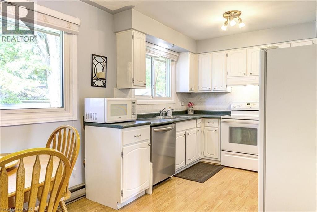 Functional kitchen with dinette area. - 12 Miller Crescent, Simcoe, ON - Indoor Photo Showing Kitchen