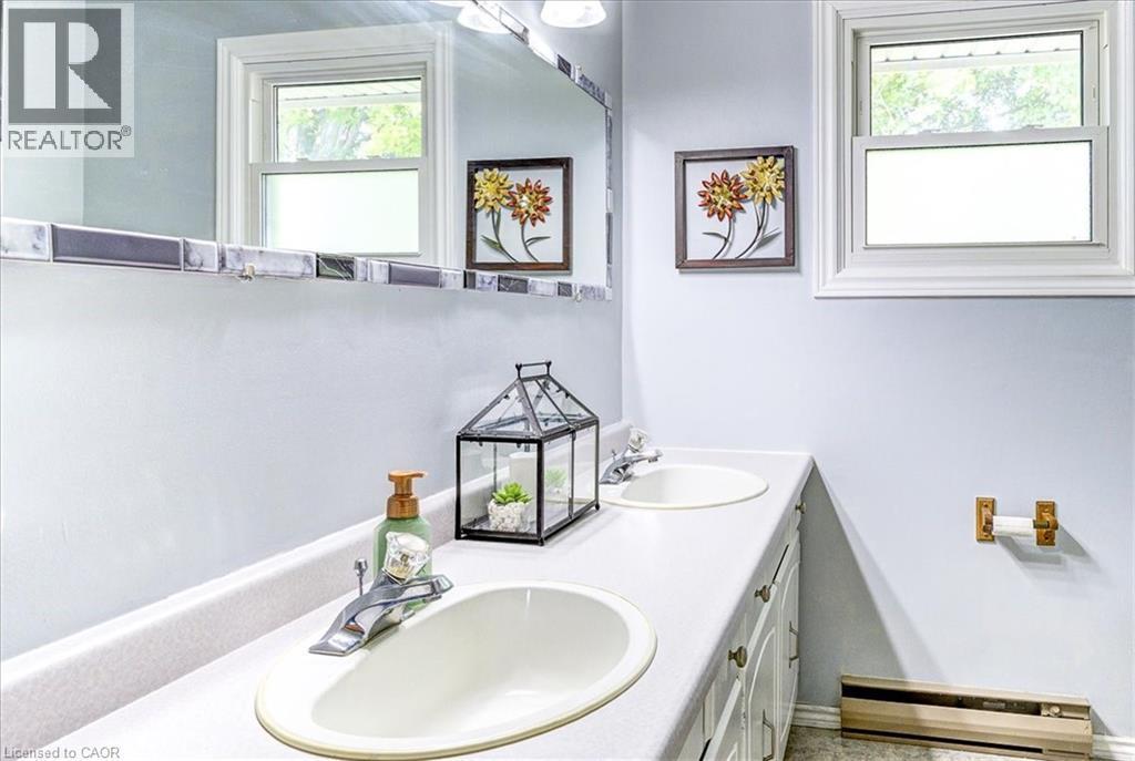 Double sinks making the morning rush a little more convenient. - 12 Miller Crescent, Simcoe, ON - Indoor Photo Showing Bathroom