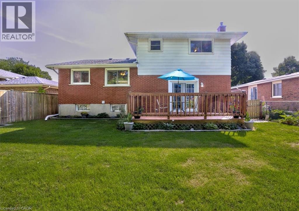 View of the back yard. - 12 Miller Crescent, Simcoe, ON - Outdoor With Deck Patio Veranda