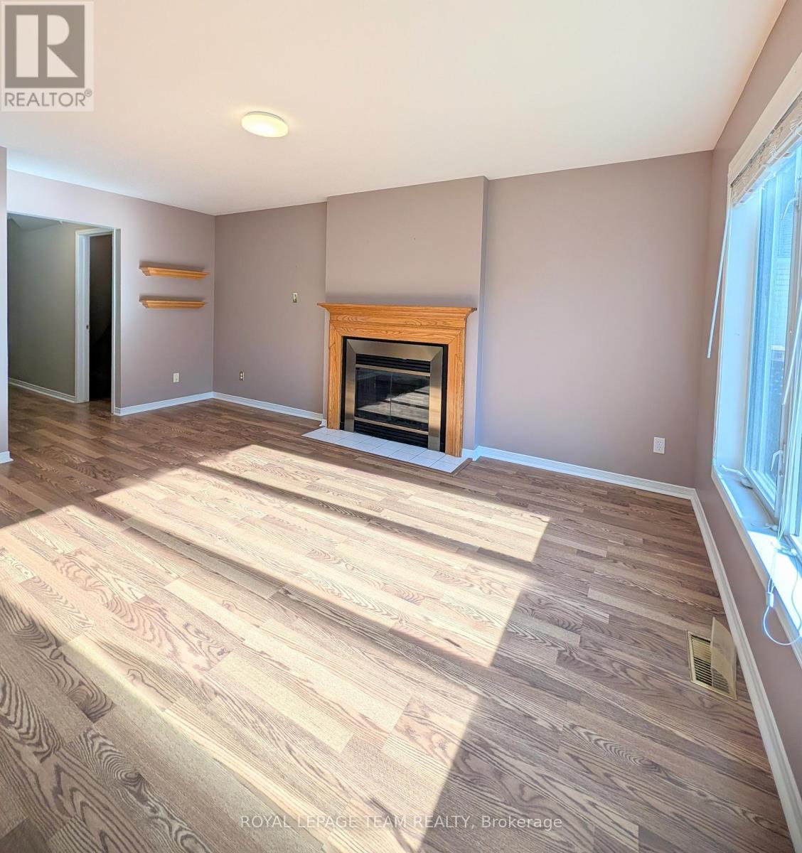 Rear facing living room / family room - 90 Moresby Drive, Ottawa, ON - Indoor Photo Showing Dining Room With Fireplace