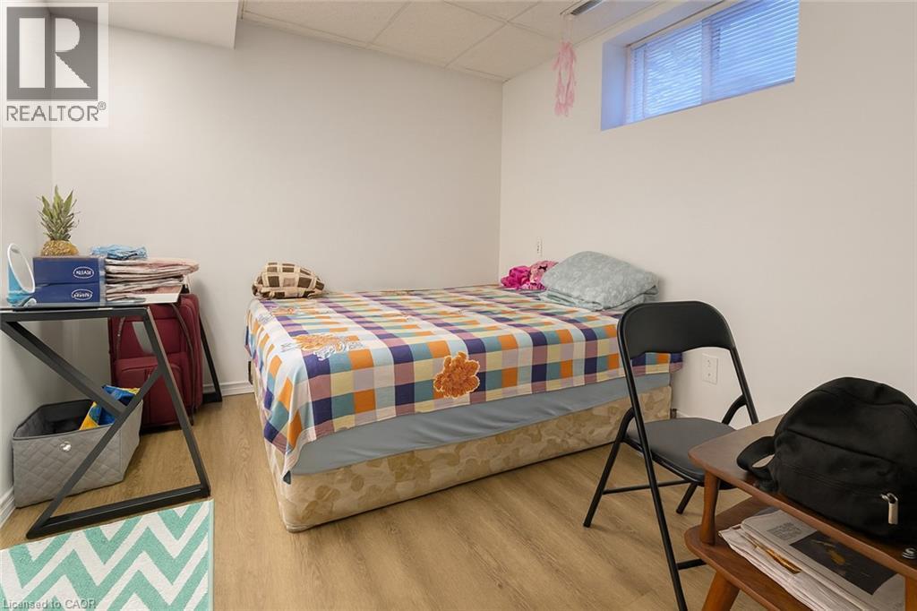 Bedroom with a drop ceiling and light wood finished floors - 988 Prosperity Court, London, ON - Indoor Photo Showing Bedroom