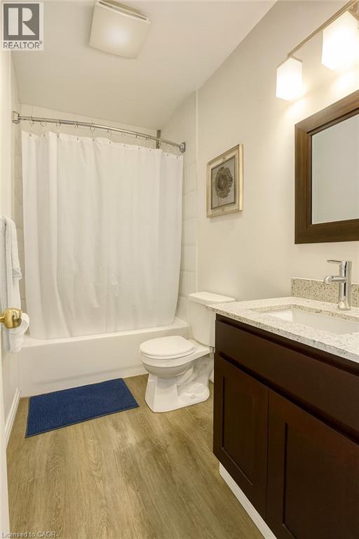 Full bathroom with vanity, light wood-style flooring, and shower / tub combo - 988 Prosperity Court, London, ON - Indoor Photo Showing Bathroom