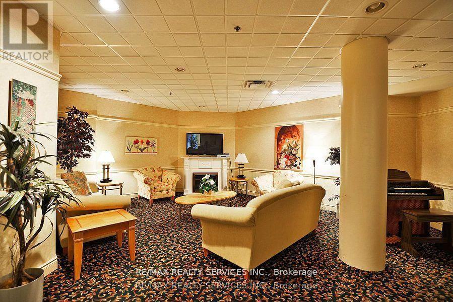 Ph03 - 7 Dayspring Circle, Brampton, ON - Indoor With Fireplace