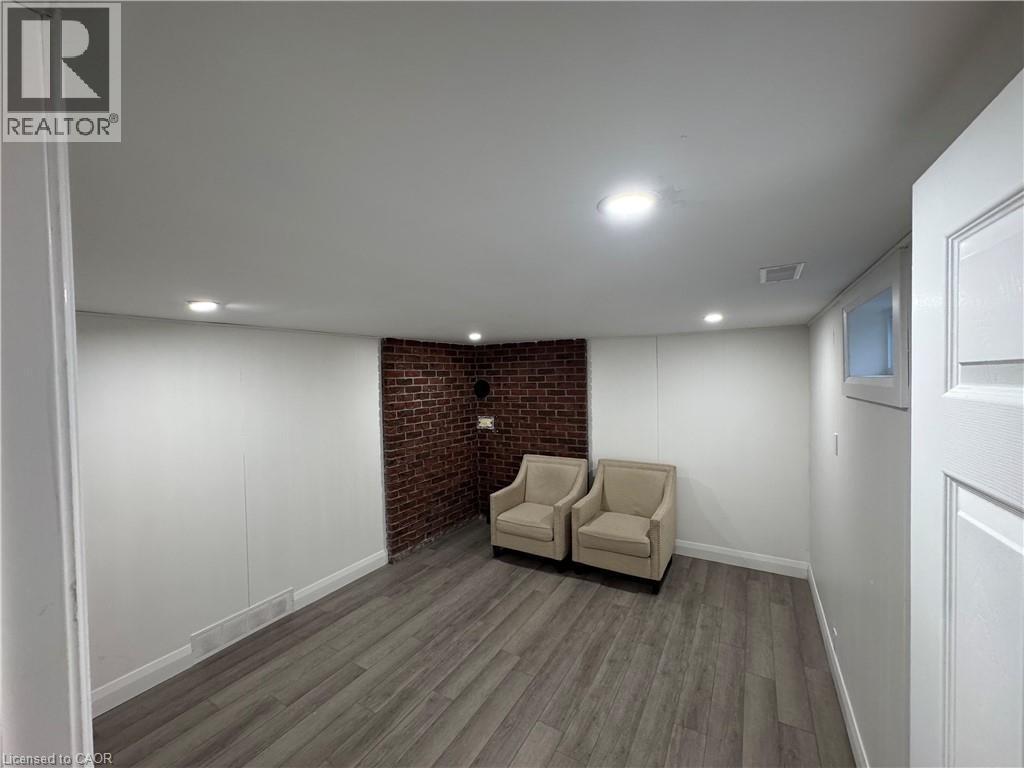 Sitting room featuring wood finished floors and recessed lighting - 18 Cyprus Drive Unit# Lower, Kitchener, ON - Indoor