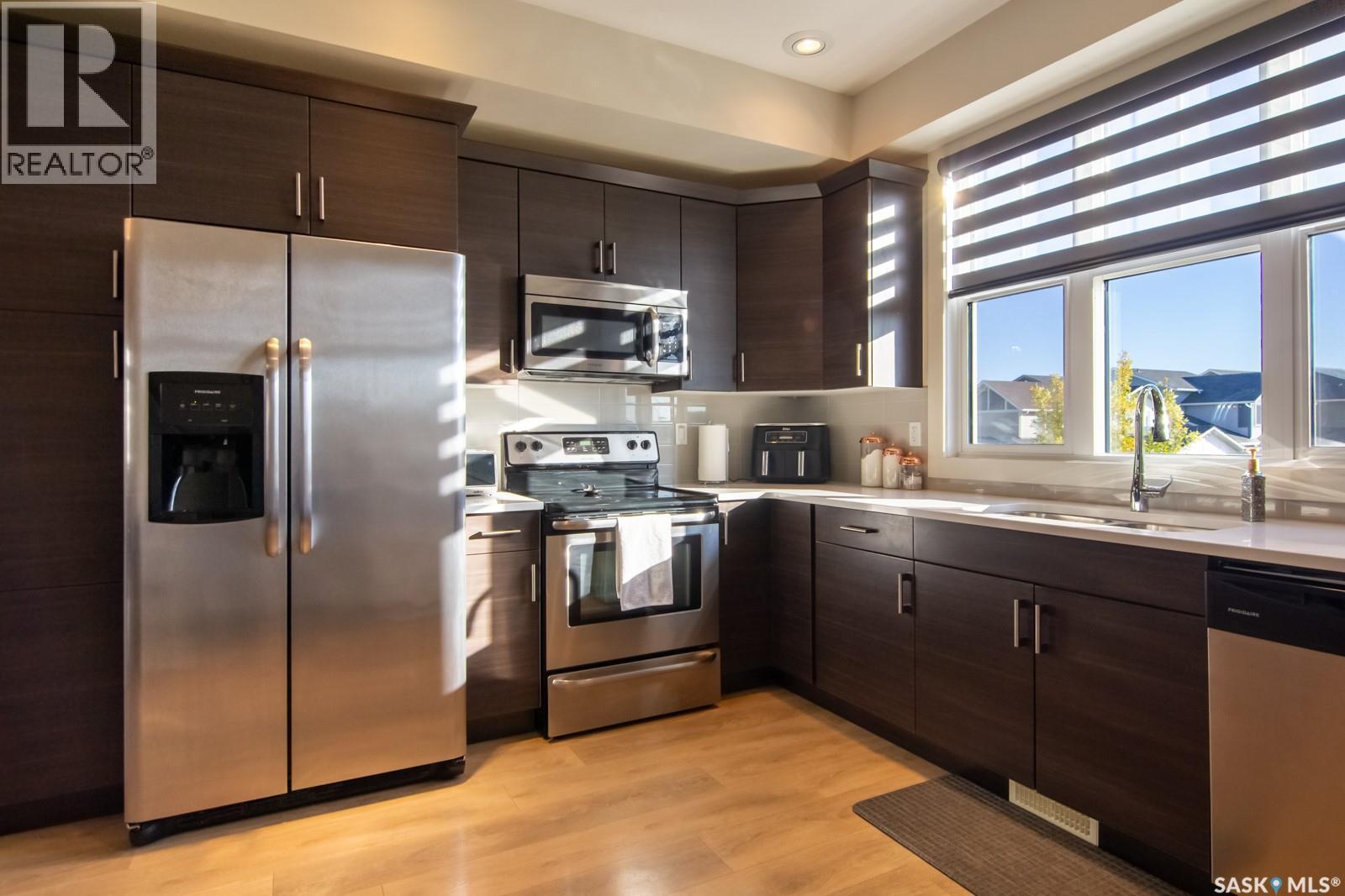 709 Meadows Boulevard, Saskatoon, SK - Indoor Photo Showing Kitchen With Double Sink