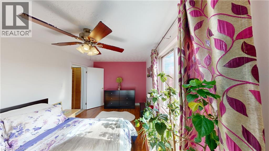 Bedroom featuring a ceiling fan and wood finished floors - 10 Armstrong Avenue, Hamilton, ON - Indoor Photo Showing Bedroom