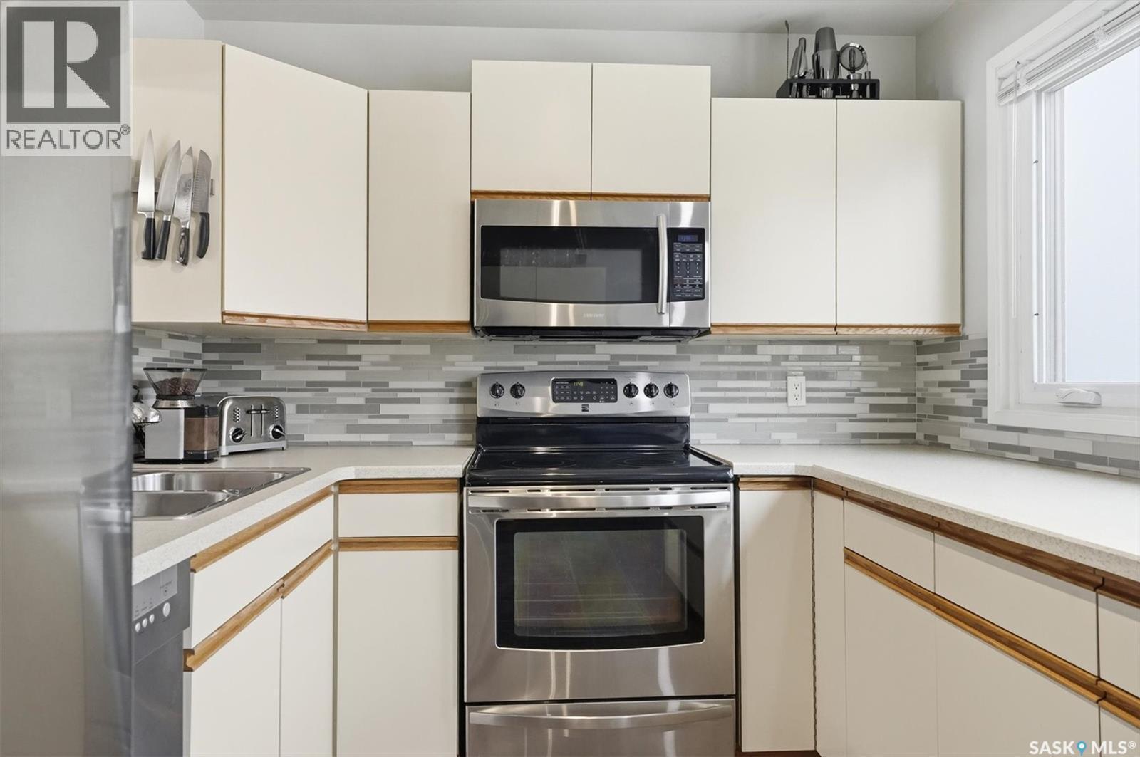 14 455 Pinehouse Drive, Saskatoon, SK - Indoor Photo Showing Kitchen With Double Sink