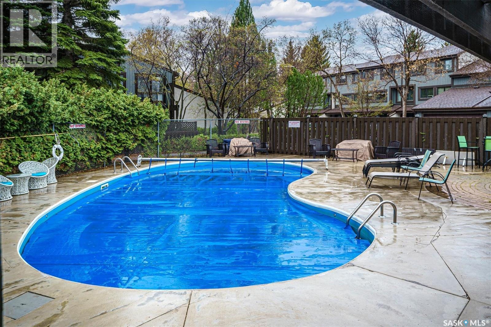 14 455 Pinehouse Drive, Saskatoon, SK - Outdoor With In Ground Pool With Deck Patio Veranda With Backyard