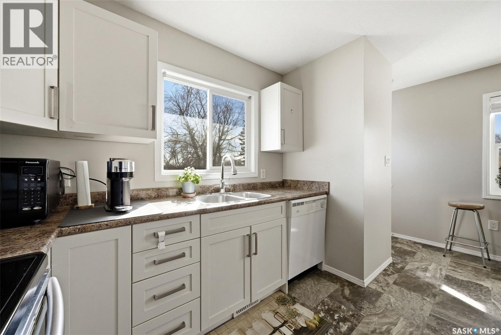 55 Schneider Crescent, Regina, SK - Indoor Photo Showing Kitchen With Double Sink