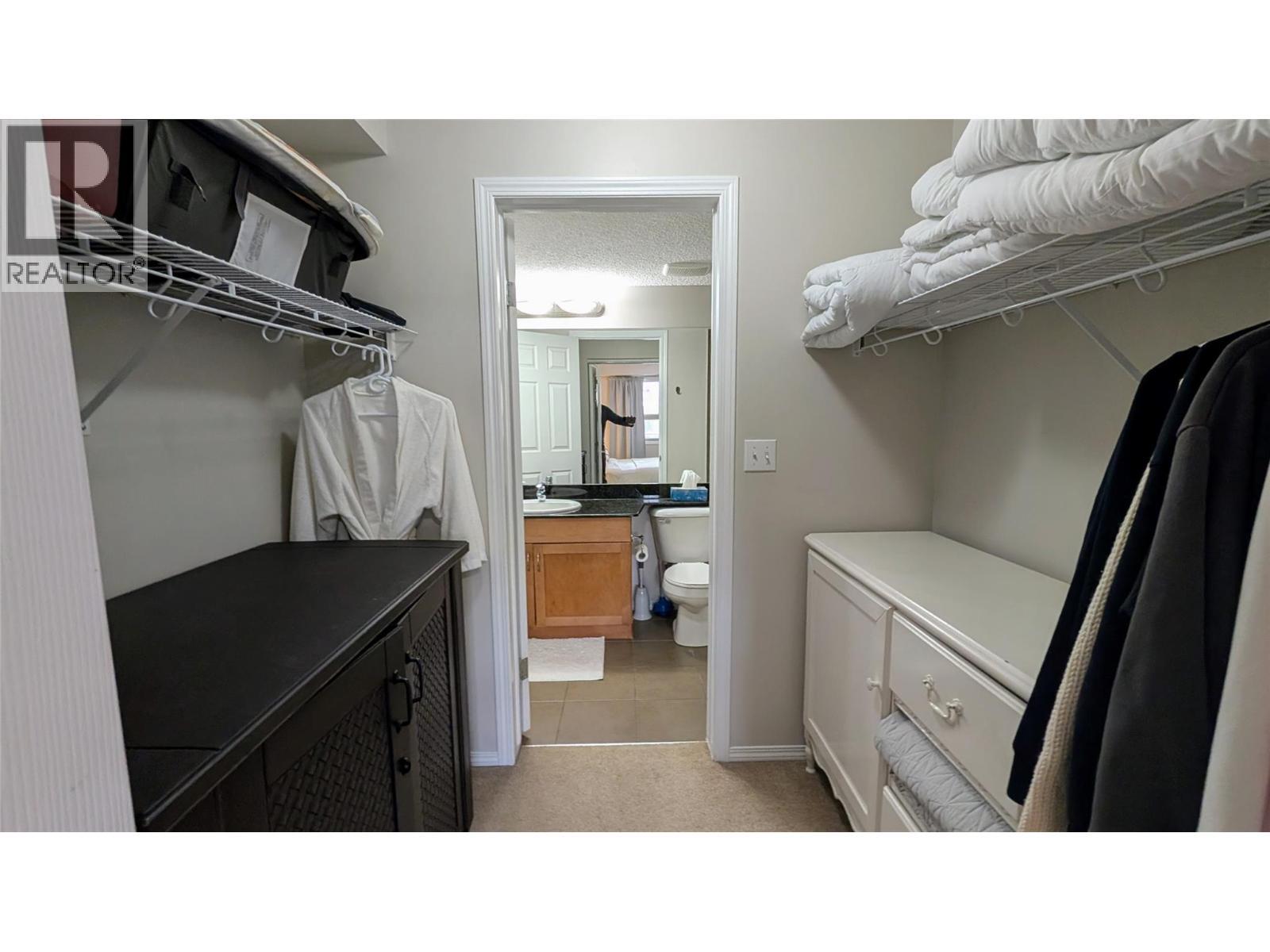 Walking Closet from Primary Bedroom - 205 Third Avenue Unit# 3307, Invermere, BC - Indoor With Storage