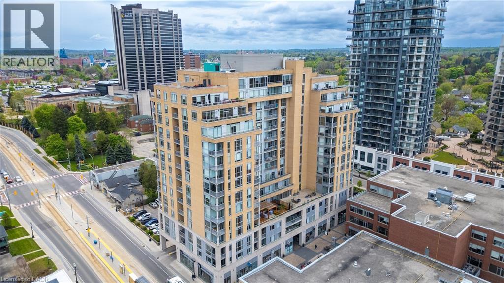 View of building exterior featuring a city view - 191 King Street S Unit# 712, Waterloo, ON - Outdoor With Facade