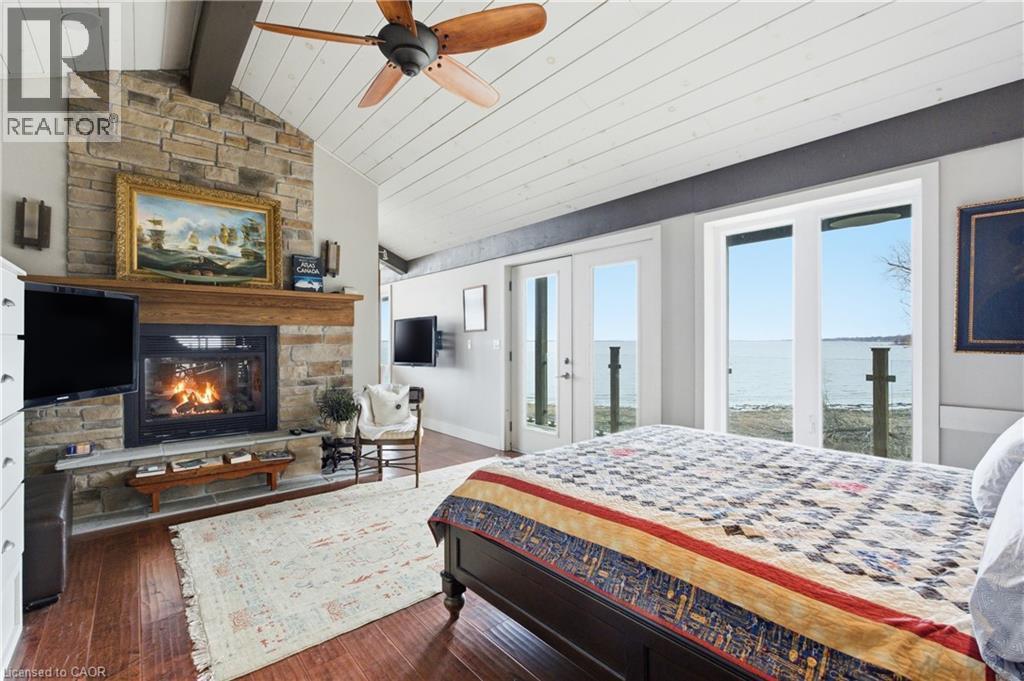 648 Front Road, St. Williams, ON - Indoor Photo Showing Bedroom With Fireplace