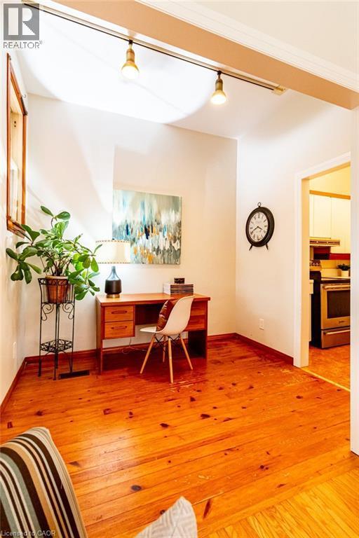 Office space with light wood finished floors and baseboards - 218 Bay Street S, Hamilton, ON