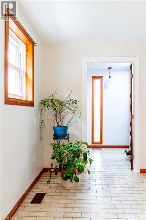Entryway featuring plenty of natural light - 218 Bay Street S, Hamilton, ON