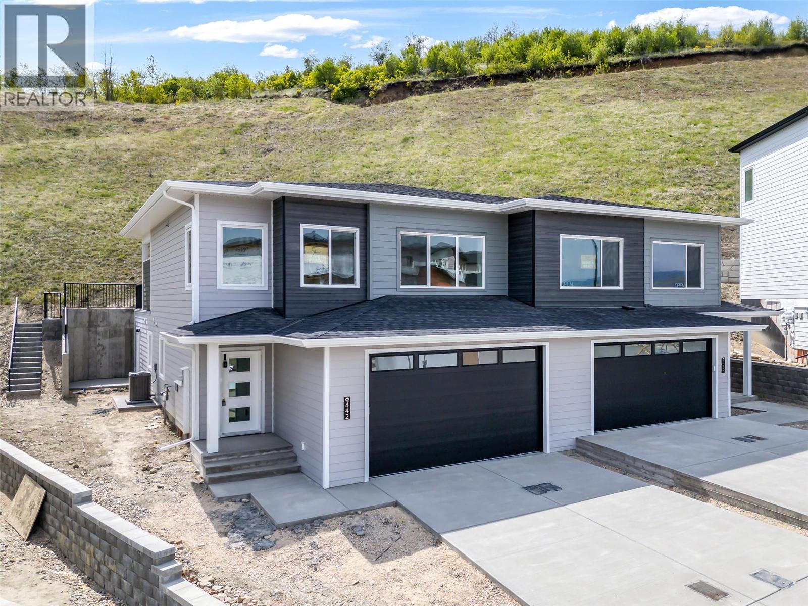 Backs onto Middleton Mountain Hiking Trails! - 442 Arrowleaf Rise, Coldstream, BC - Outdoor With Facade