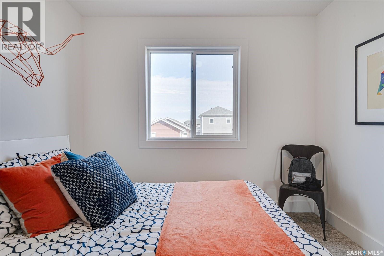 65 Rosewood Boulevard E, Saskatoon, SK - Indoor Photo Showing Bedroom