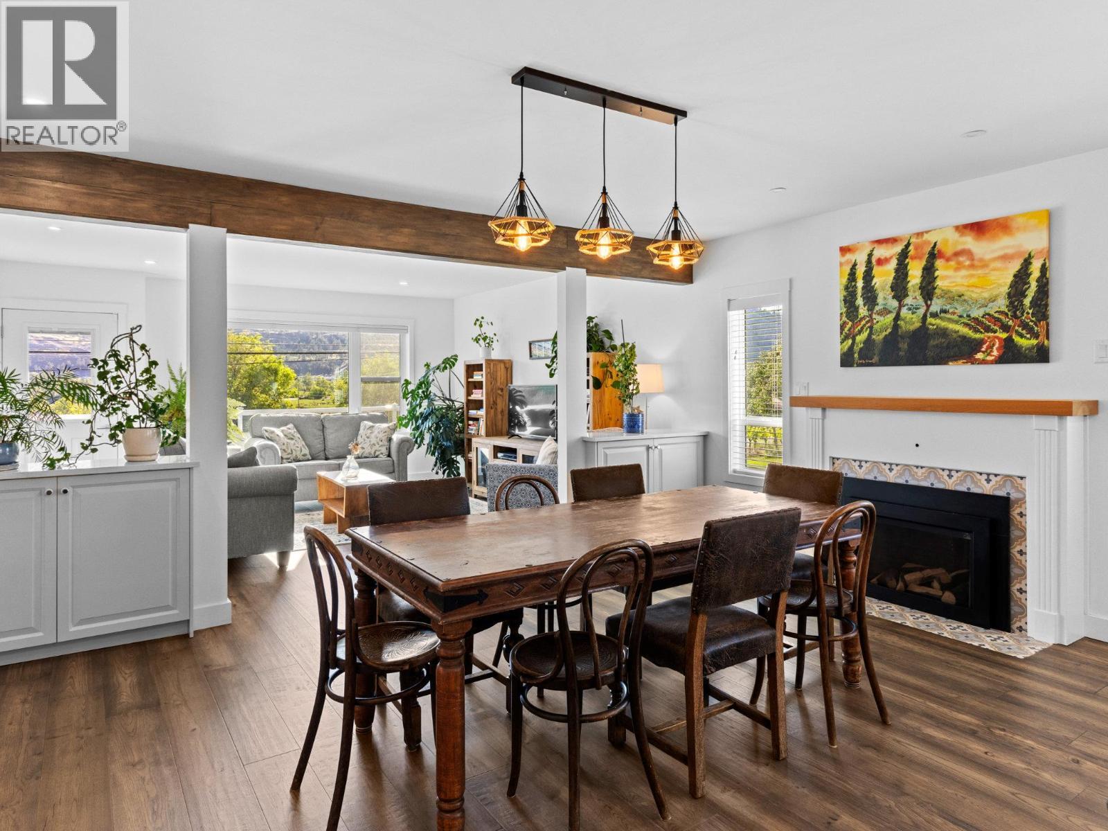 7207 Tucelnuit Drive, Oliver, BC - Indoor Photo Showing Dining Room With Fireplace