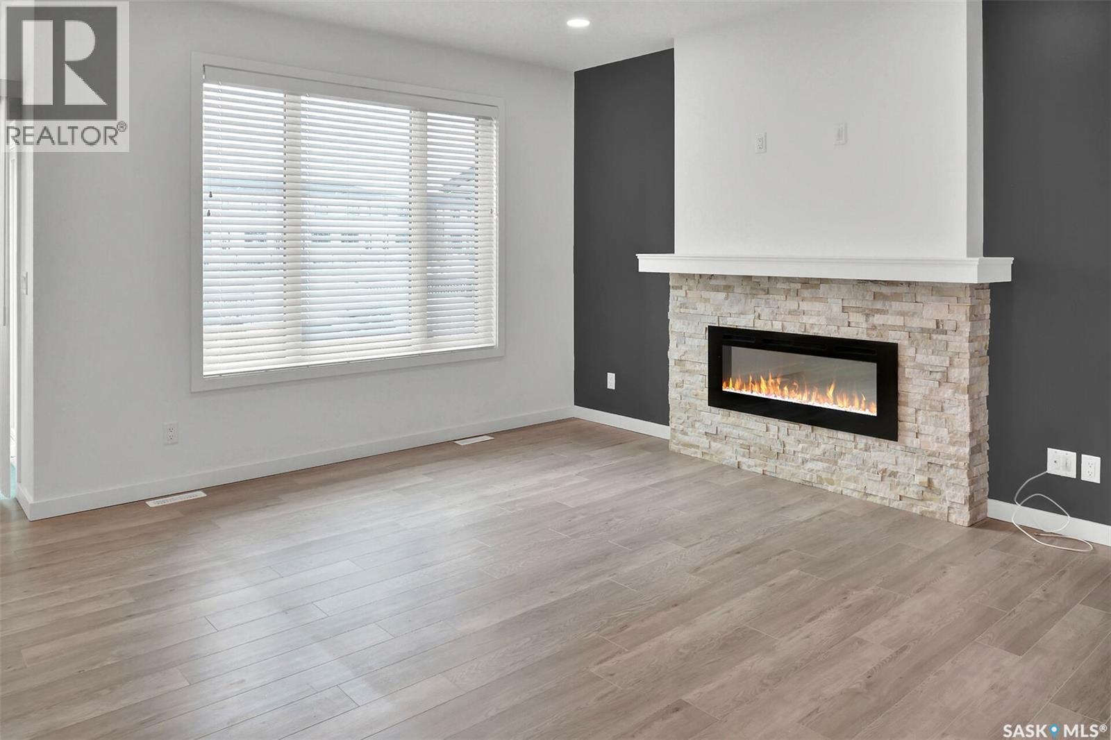 104 Forsey Avenue, Saskatoon, SK - Indoor Photo Showing Living Room With Fireplace