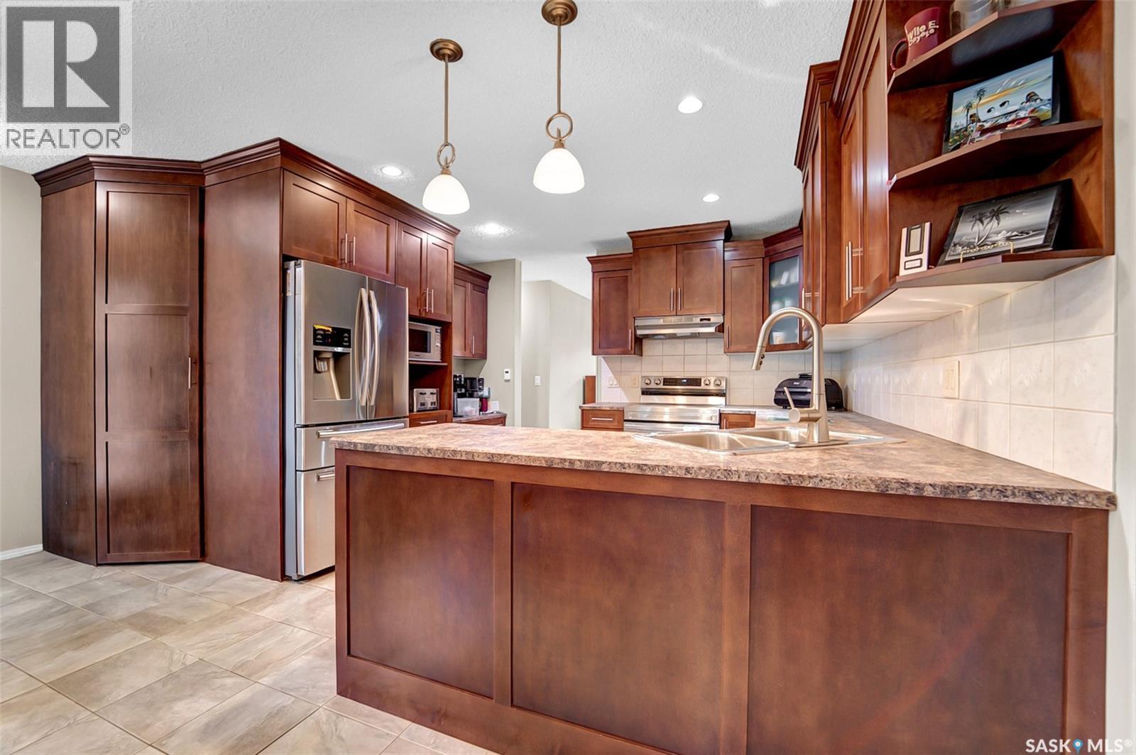 143 Biro Place, Saskatoon, SK - Indoor Photo Showing Kitchen With Double Sink