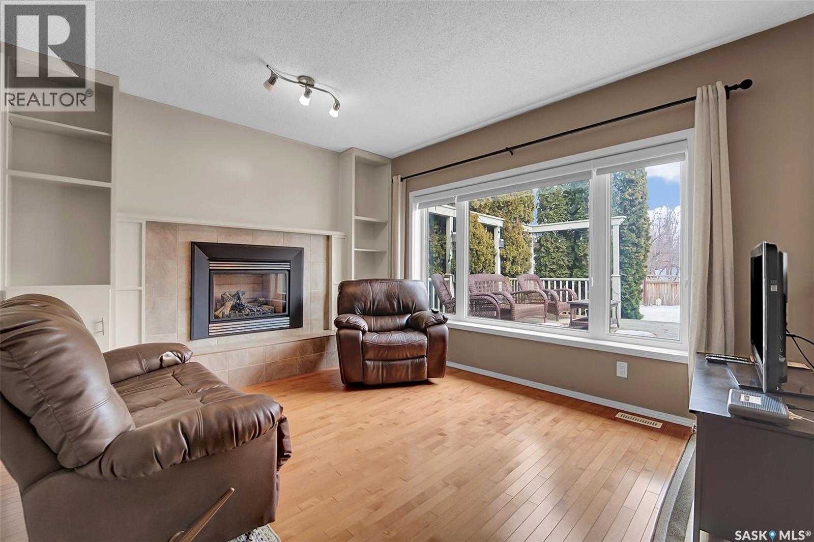 143 Biro Place, Saskatoon, SK - Indoor Photo Showing Living Room With Fireplace