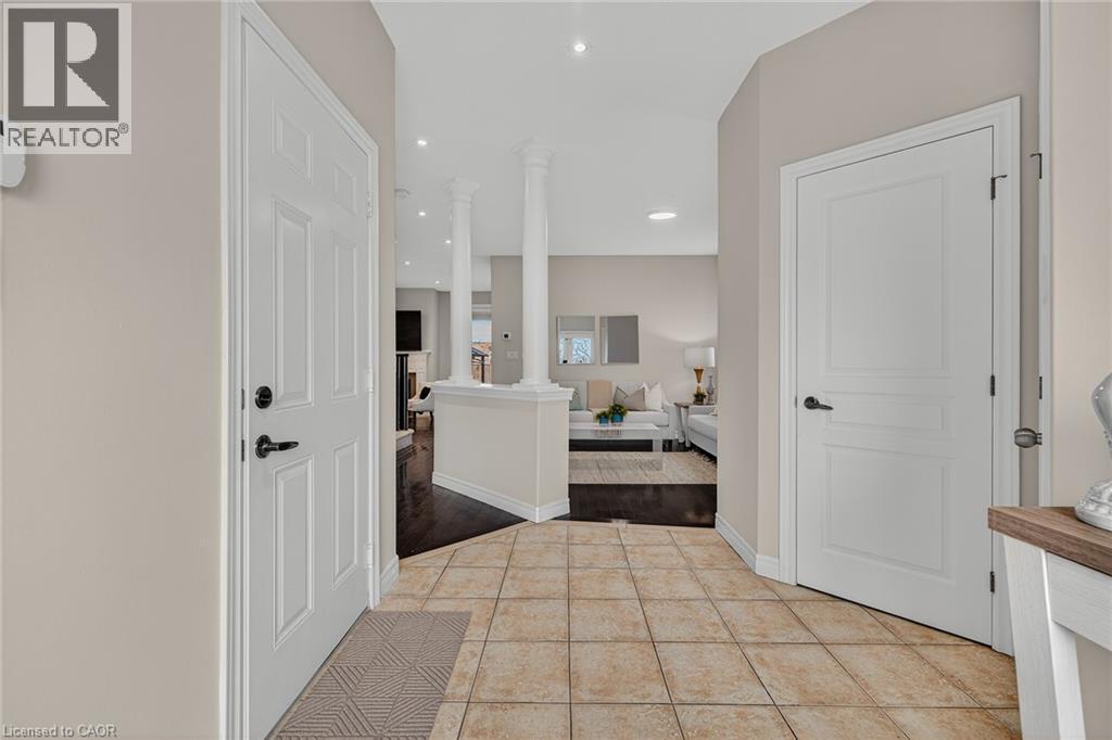 Hallway featuring decorative columns, recessed lighting, and light tile patterned floors - 100 Garinger Crescent, Binbrook, ON - Indoor Photo Showing Other Room