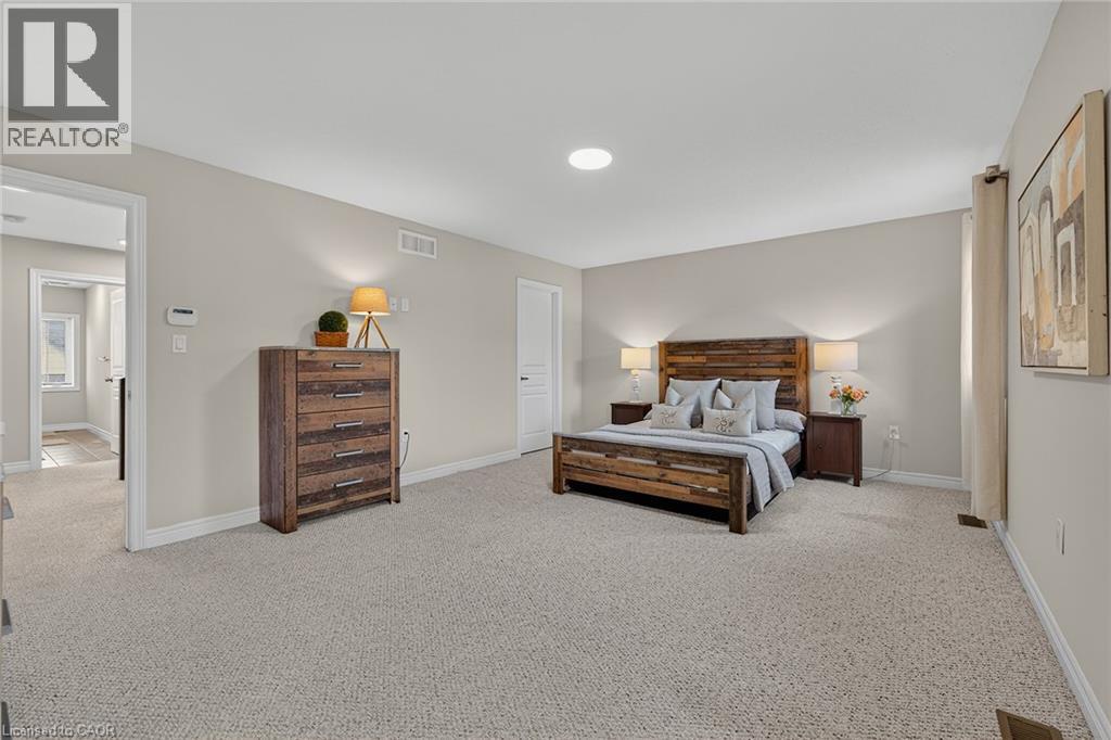 Bedroom featuring light colored carpet and recessed lighting - 100 Garinger Crescent, Binbrook, ON - Indoor Photo Showing Bedroom