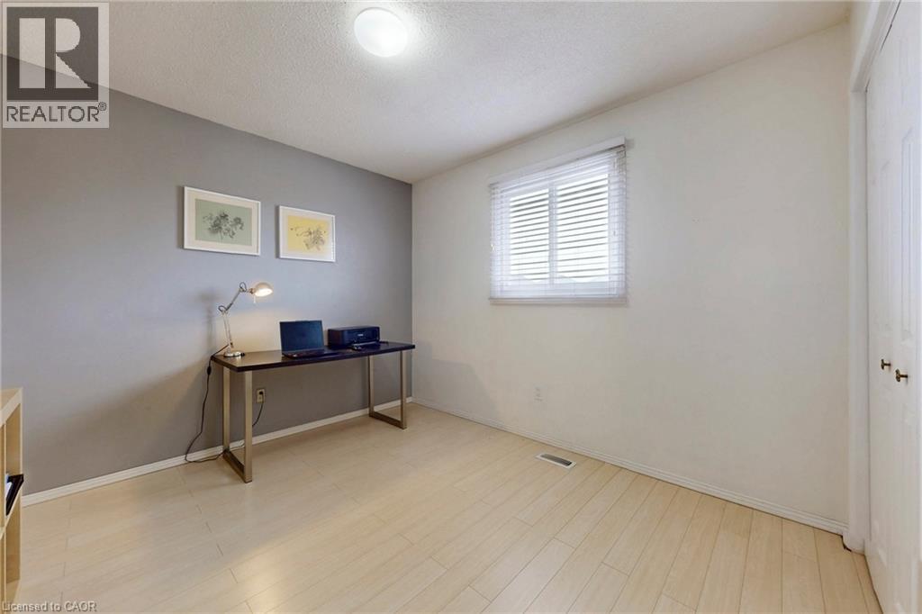 Home office featuring light wood finished floors and a textured ceiling - 62 Como Place, Hamilton, ON - Indoor