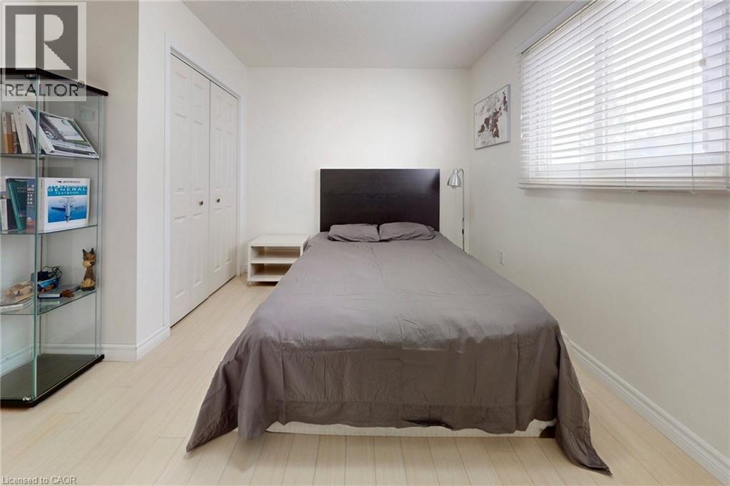 Bedroom featuring light wood-style flooring and a closet - 62 Como Place, Hamilton, ON - Indoor Photo Showing Bedroom