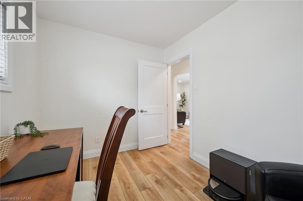 Office area with light wood-style flooring and baseboards - 699 Frederick Street, Kitchener, ON - Indoor