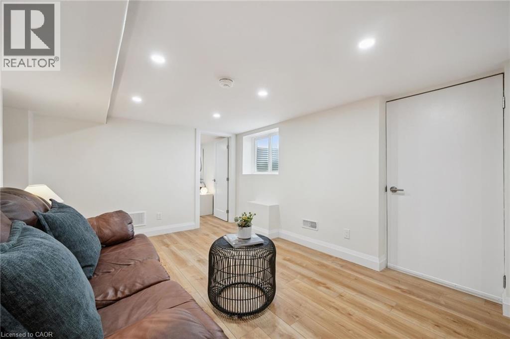 Living area with light wood finished floors and recessed lighting - 699 Frederick Street, Kitchener, ON - Indoor