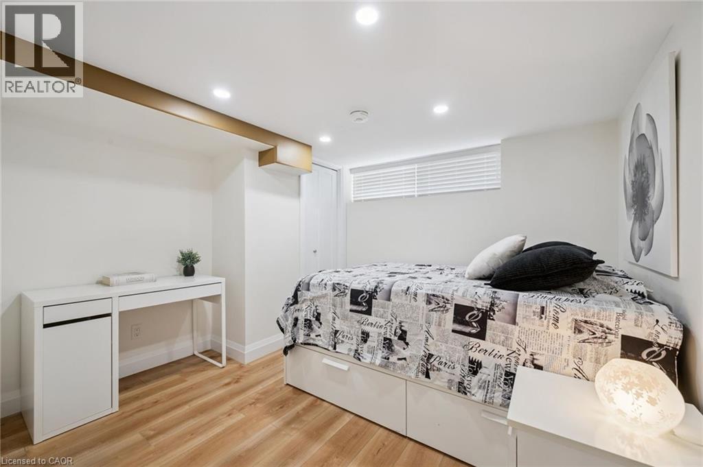 Bedroom with light wood-type flooring and recessed lighting - 699 Frederick Street, Kitchener, ON - Indoor Photo Showing Bedroom