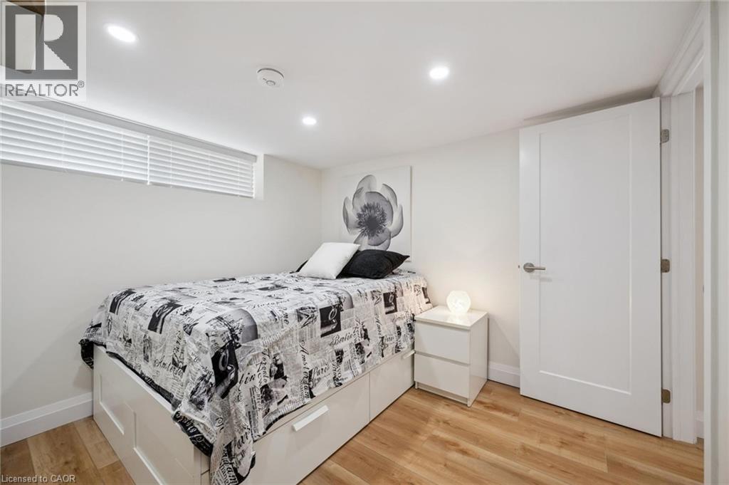 Bedroom featuring light wood-type flooring and recessed lighting - 699 Frederick Street, Kitchener, ON - Indoor Photo Showing Bedroom