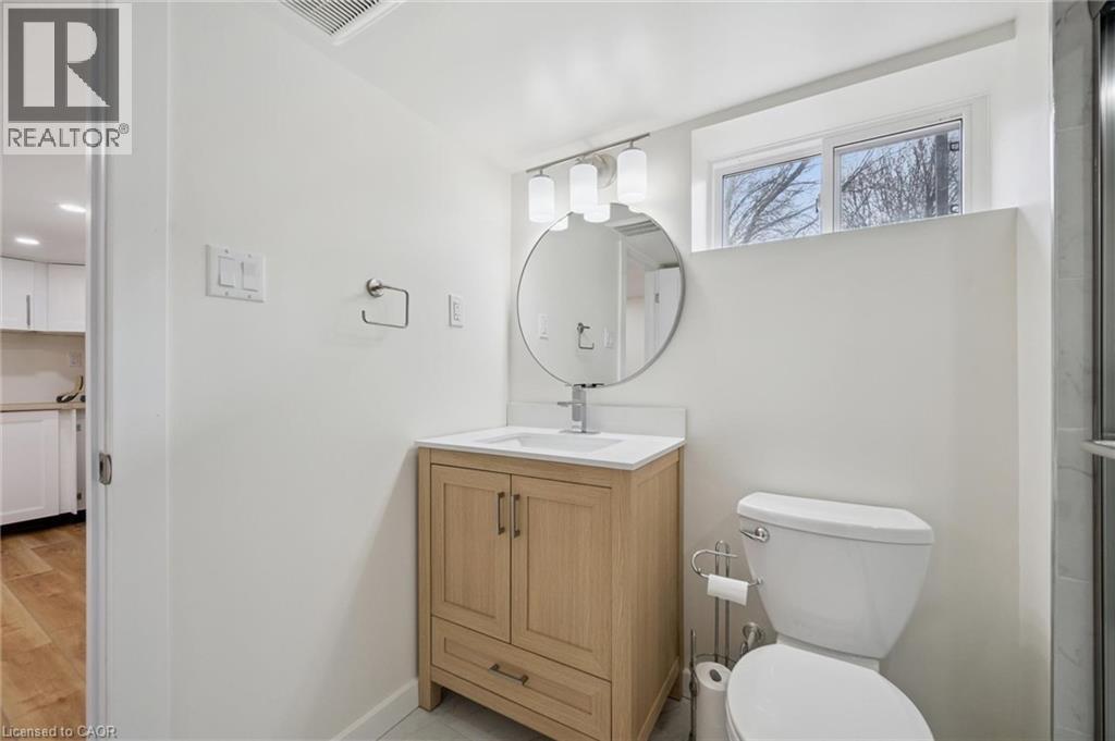 Bathroom with toilet and vanity - 699 Frederick Street, Kitchener, ON - Indoor Photo Showing Bathroom