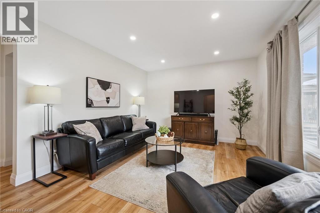 Living room featuring light wood finished floors and recessed lighting - 699 Frederick Street, Kitchener, ON - Indoor Photo Showing Living Room