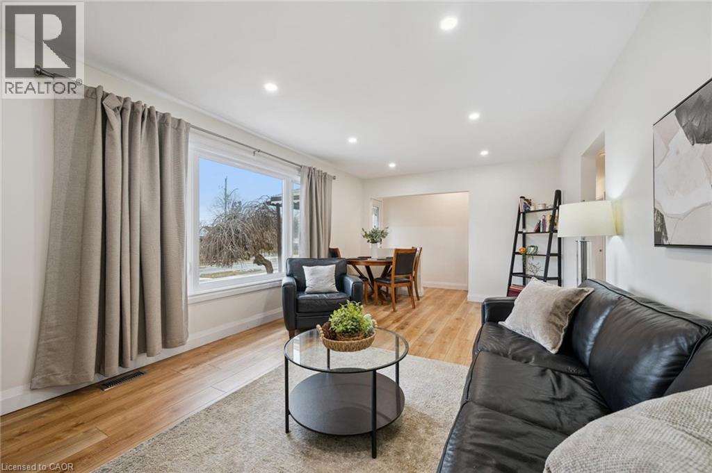 Living room with light wood-style floors and recessed lighting - 699 Frederick Street, Kitchener, ON - Indoor Photo Showing Living Room