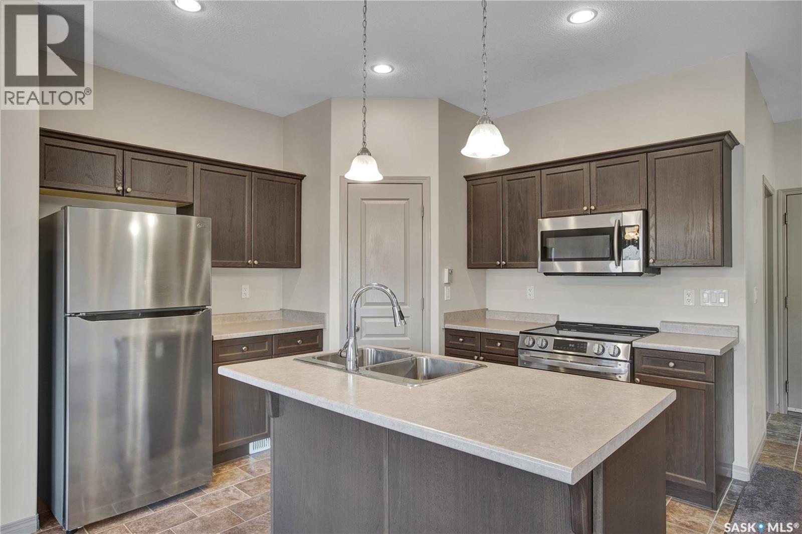 211 Mcbeth Crescent, Saskatoon, SK - Indoor Photo Showing Kitchen With Double Sink With Upgraded Kitchen