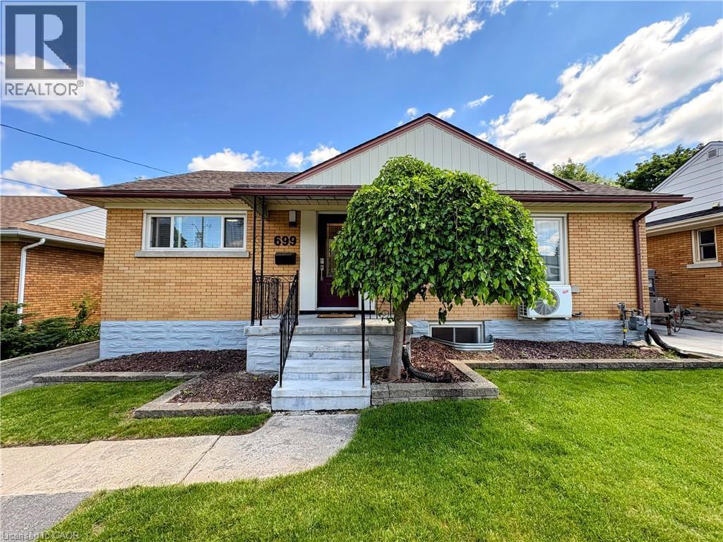 Brick exterior with a peaked roofline and white soffit - 699 Frederick Street, Kitchener, ON