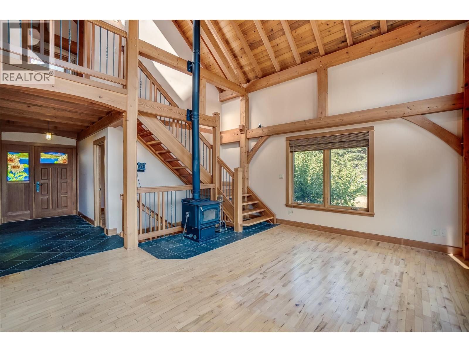 130 8Th Street N, Kaslo, BC - Indoor Photo Showing Other Room With Fireplace