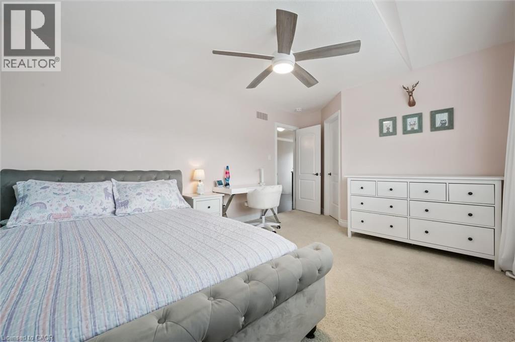 Bedroom featuring light colored carpet and ceiling fan - 469 Woodbine Avenue, Kitchener, ON - Indoor Photo Showing Bedroom