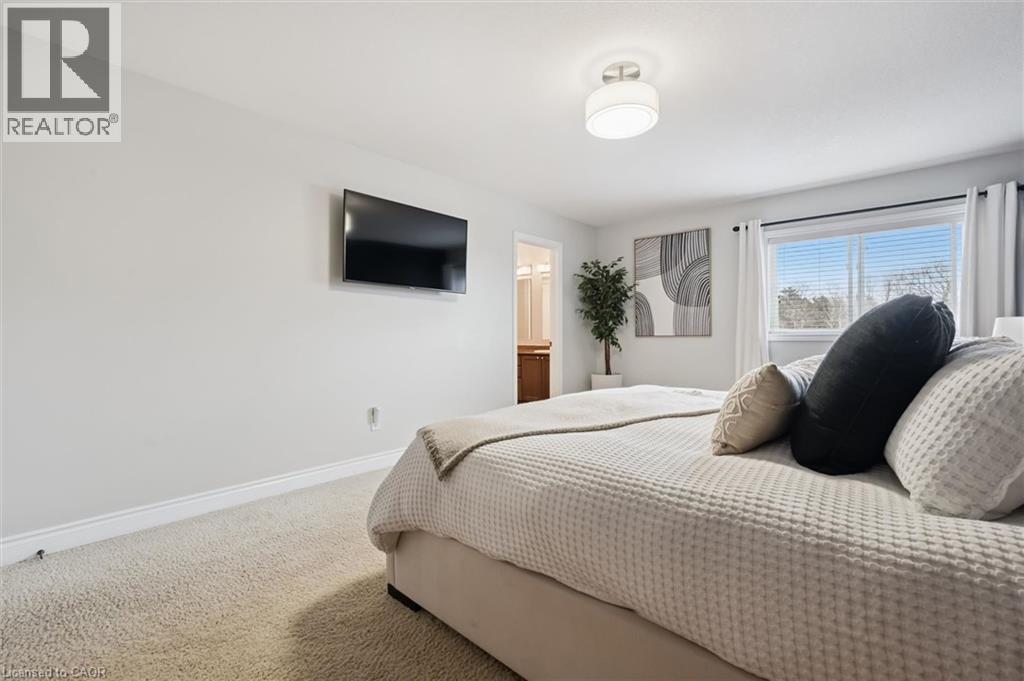 Bedroom with carpet floors and ensuite bathroom - 469 Woodbine Avenue, Kitchener, ON - Indoor Photo Showing Bedroom