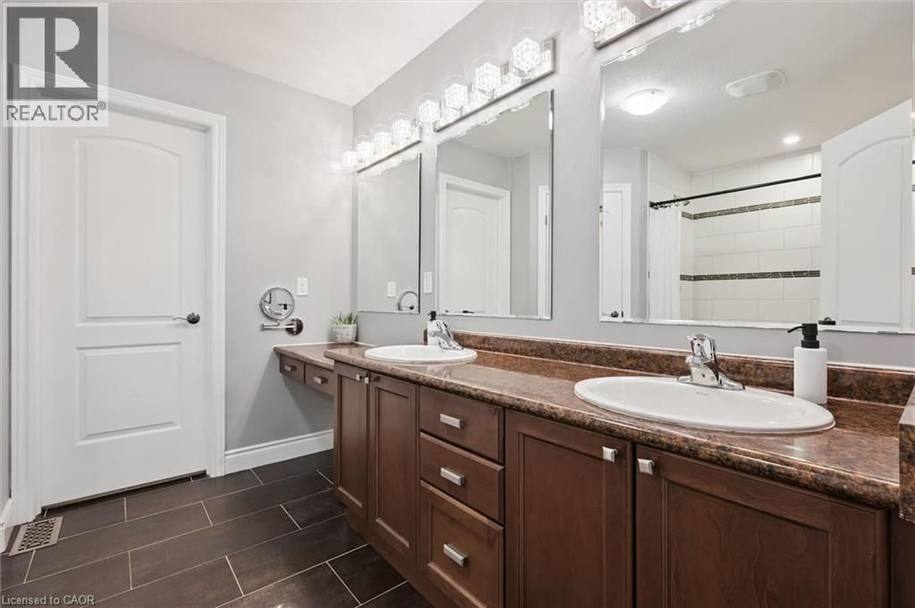 Full bathroom featuring double vanity and tiled shower - 469 Woodbine Avenue, Kitchener, ON - Indoor Photo Showing Bathroom