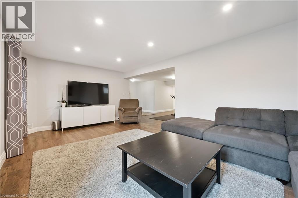 Living room with light wood finished floors and recessed lighting - 469 Woodbine Avenue, Kitchener, ON - Indoor Photo Showing Living Room