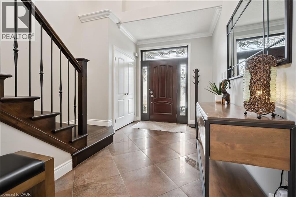 Foyer with ornamental molding and light tile patterned floors - 469 Woodbine Avenue, Kitchener, ON - Indoor Photo Showing Other Room