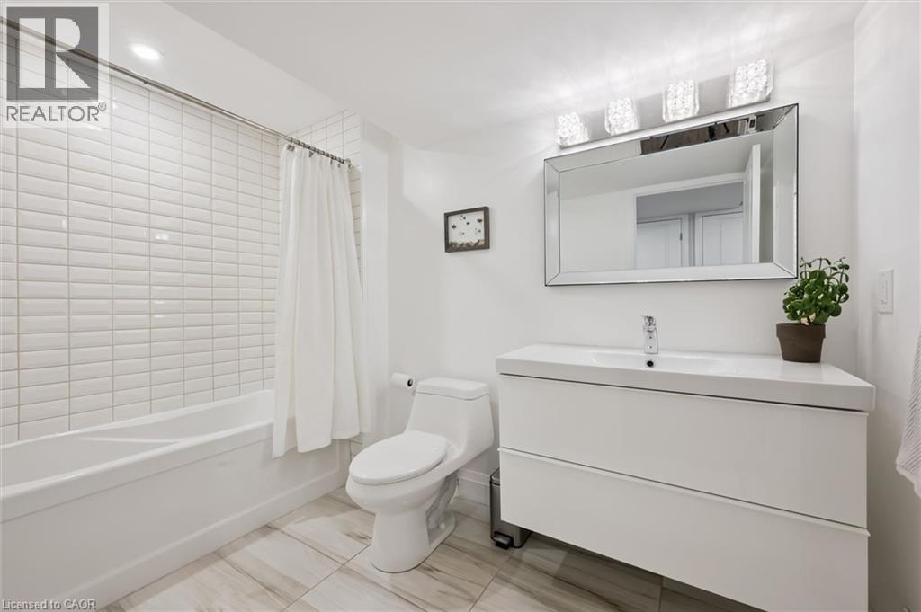 Full bathroom with vanity, shower / bath combo, and recessed lighting - 469 Woodbine Avenue, Kitchener, ON - Indoor Photo Showing Bathroom