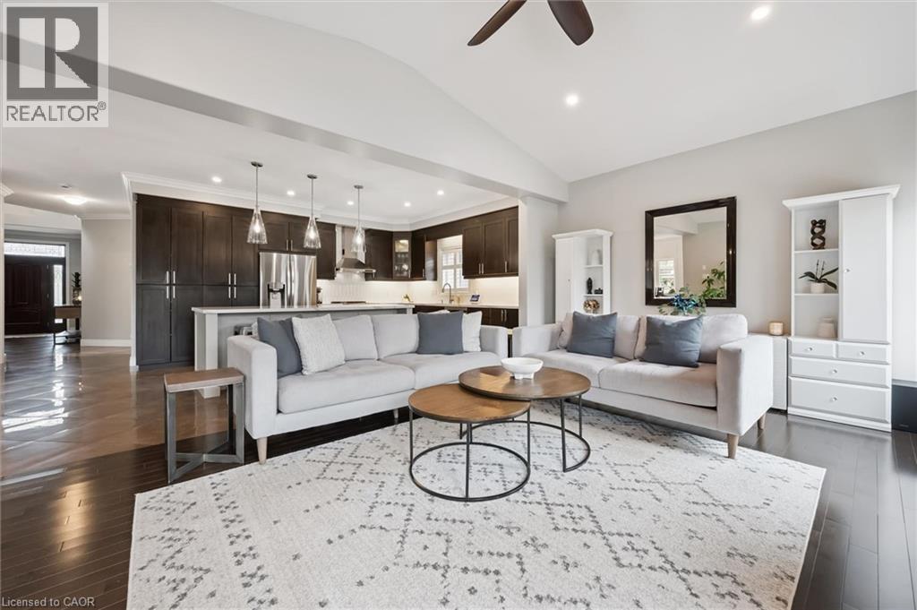 Living area with ceiling fan, recessed lighting, vaulted ceiling, and dark wood-style flooring - 469 Woodbine Avenue, Kitchener, ON - Indoor Photo Showing Living Room