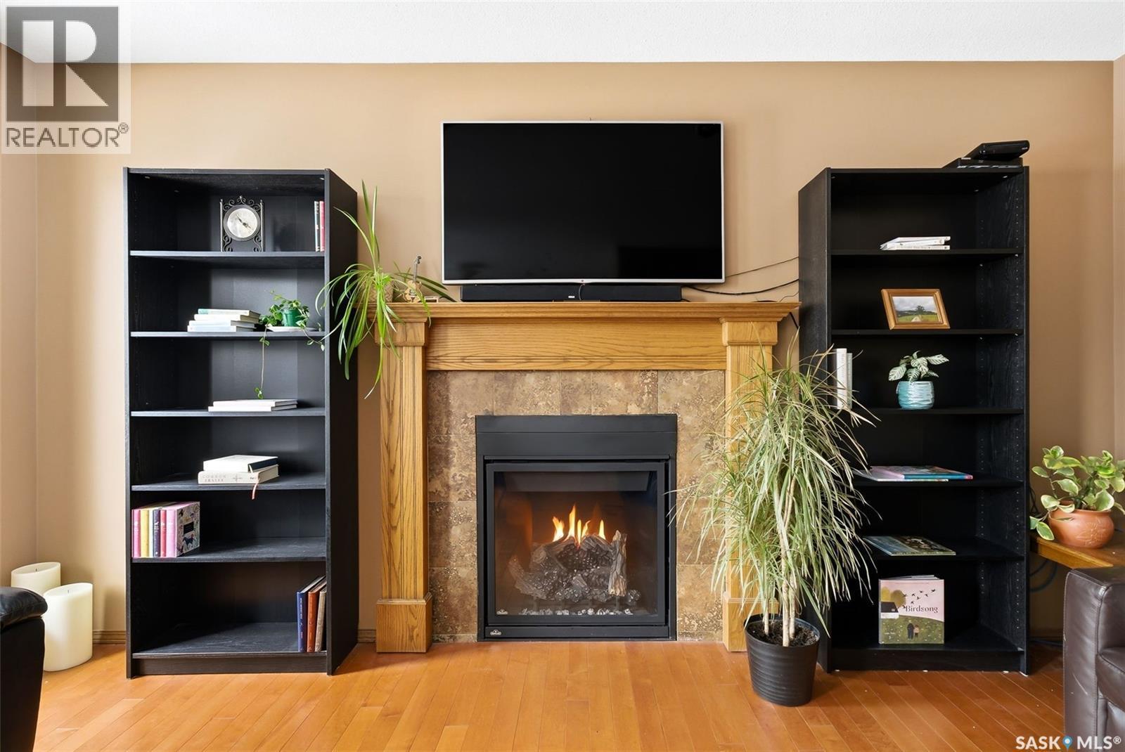 3803 Bow Bay, Regina, SK - Indoor Photo Showing Living Room With Fireplace