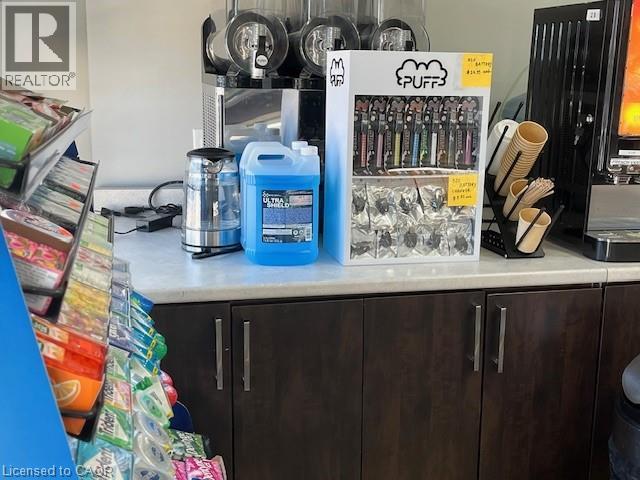 Detailed view of light countertops and dark wood finish cabinets - 556 Stirling Avenue S, Kitchener, ON