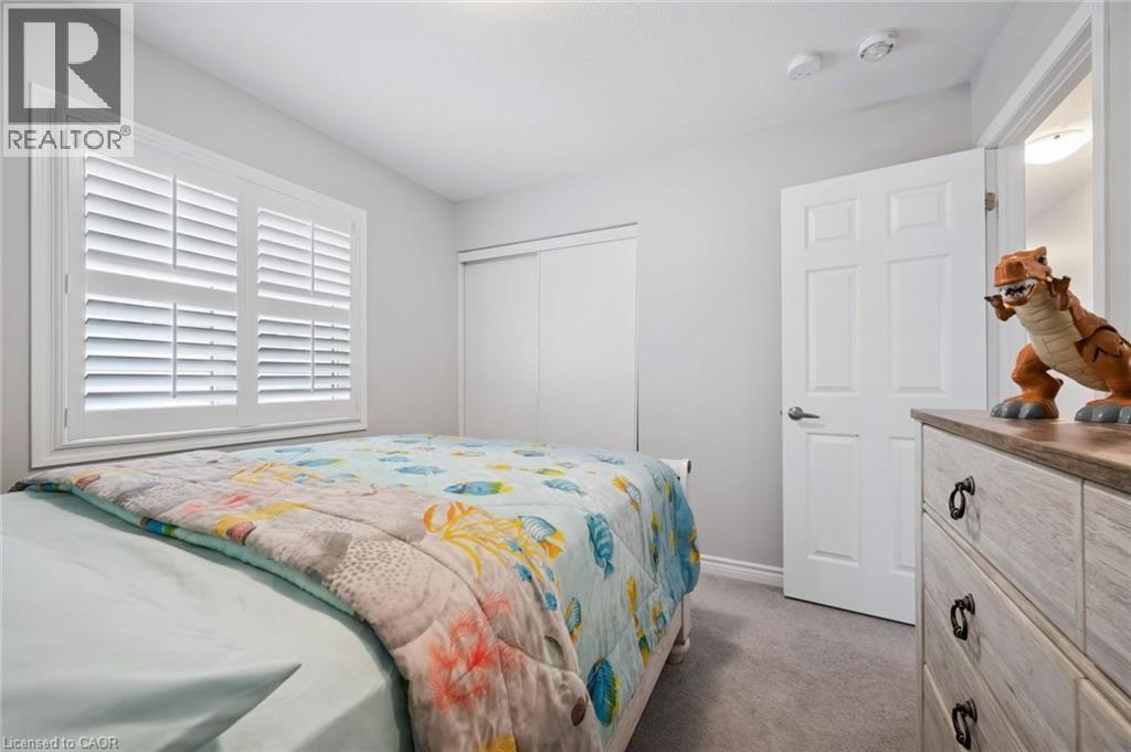 Bedroom with dark colored carpet and a closet - 38 Park Glen Street, Kitchener, ON - Indoor Photo Showing Bedroom