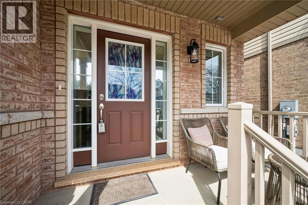 Property entrance featuring a porch and brick siding - 38 Park Glen Street, Kitchener, ON - Outdoor With Deck Patio Veranda With Exterior