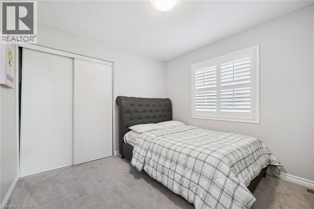 Carpeted bedroom with a closet and baseboards - 38 Park Glen Street, Kitchener, ON - Indoor Photo Showing Bedroom